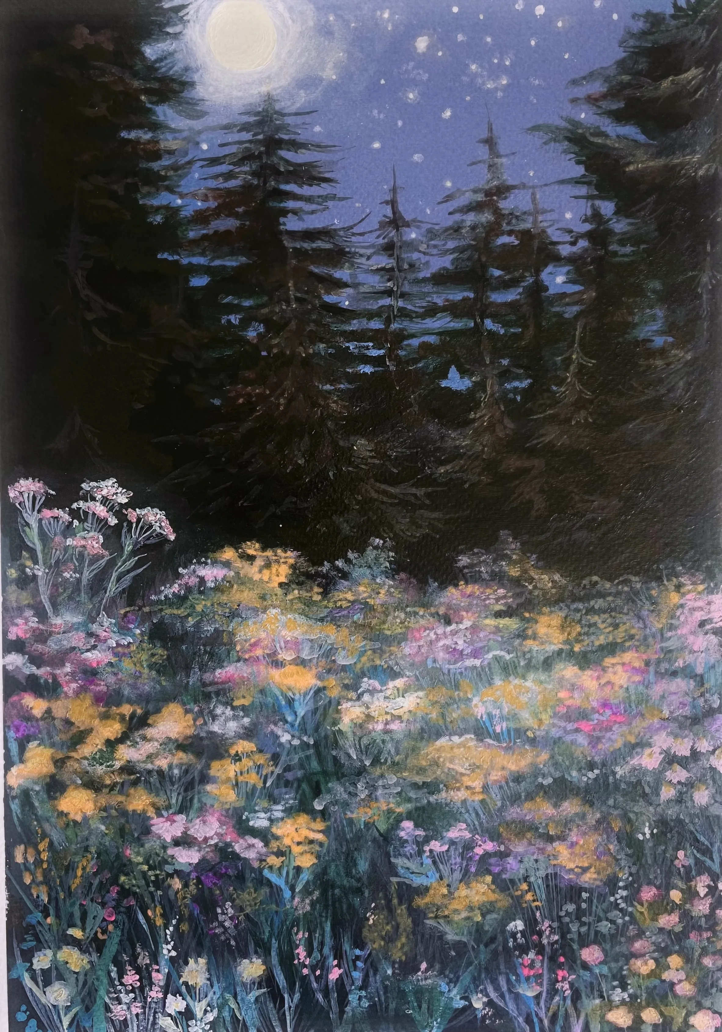 A moonlit field of pink, gold and lavender wildflowers blooms in a clearing surrounded by dark evergreen trees.